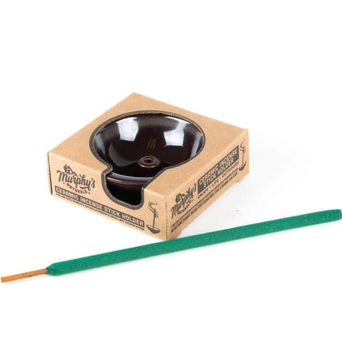 Murphy's Naturals brand circular ceramic incense stick holder; shown in cardboard packaging.