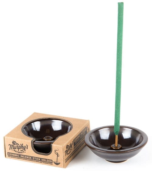 Murphy's Naturals brand circular ceramic incense stick holder; shown holding a Murphy's Naturals mosquito repellent incense stick