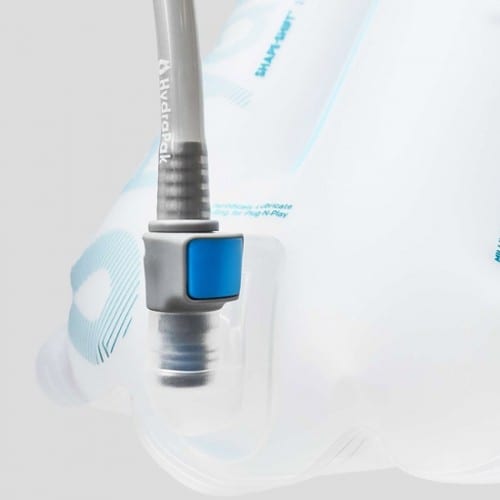 Close up display of Plug-N-Play connection port with hose locked into place on reusable Hydrapak brand shape shift 2 liter hydration reservoir.