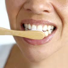 Close up view of zero waste toothpaste tablets, made by Unpaste brand, in use while person is brushing their teeth.