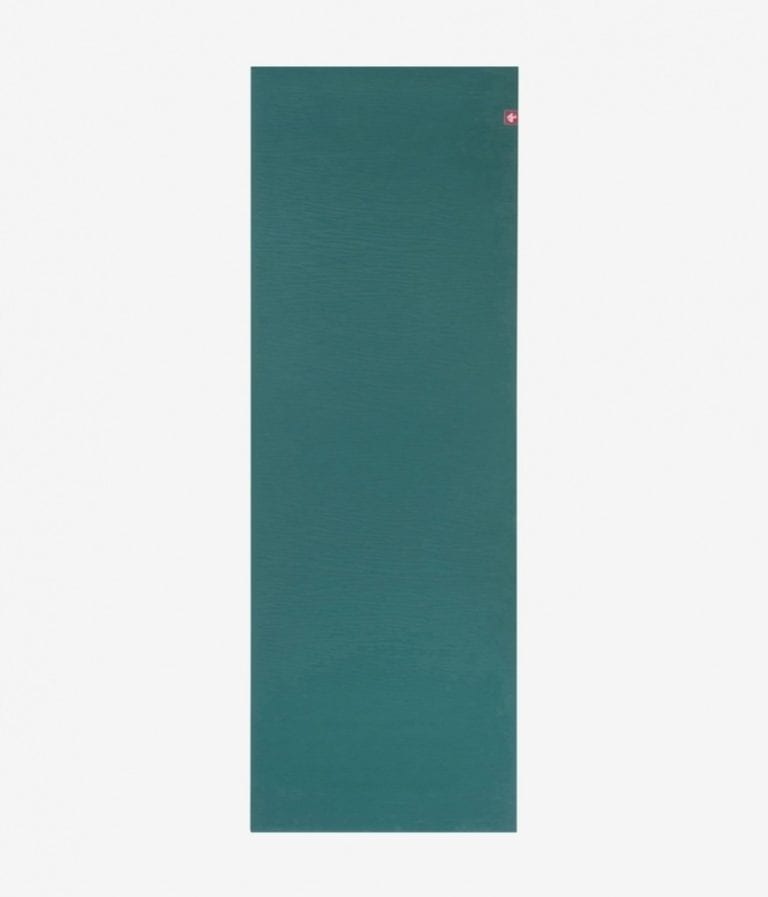 Manduka brand natural rubber 4mm yoga mat in sage/green; shown unrolled
