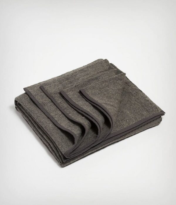 Manduka brand wool blanket in sediment gray; made with 100% recycled fibers