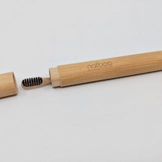 Ecofriendly Natboo brand biodegradable bamboo toothbrush inside bamboo Natboo brand oval travel case with cap off.  Sold together as Travel set.