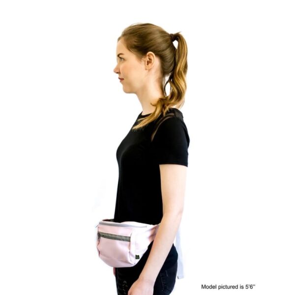 Side photo of female wearing an eco friendly EcoGear Product brand pink Skipper Hip pack around her waist