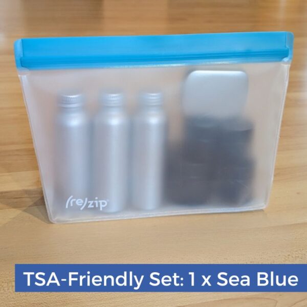 View of reusable, clear TSA friendly travel toiletry container set packed in leak-proof silicone, stand-up bag