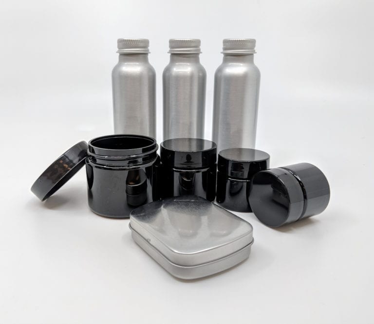 Product display of eco friendly reusable containers that make up Reusable TSA-Friendly Travel Container Set.