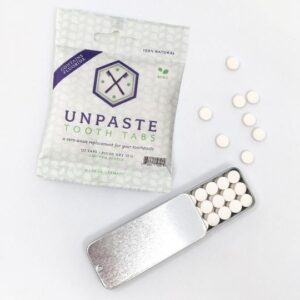 Plastic-free toothpaste tablets with fluoride and slider travel tin