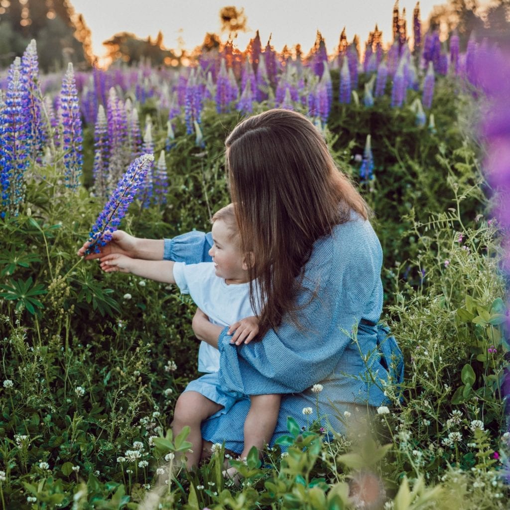 Mother's Day Gift Guide Blog Mom in field with baby