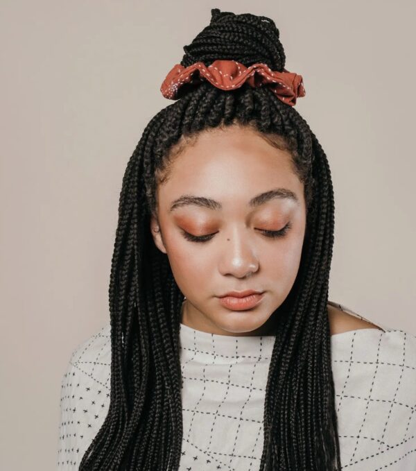 Woman with fair-trade, artisan-made scrunchie in hair