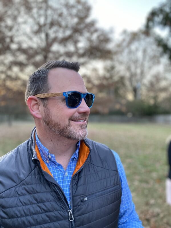 Guy wearing eco friendly Blue Planet sunglasses.