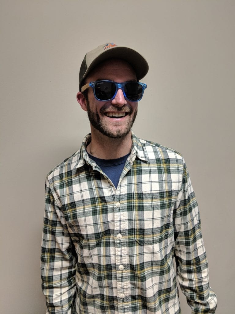 Guy wearing eco friendly Blue Planet sunglasses.