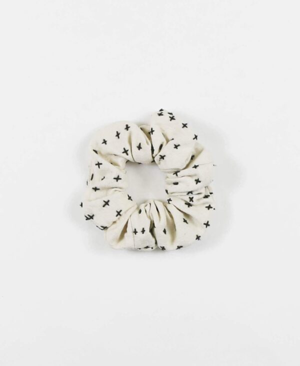 Overhead product display of environmentally friendly fair trade organic cotton Anchal brand scrunchie bone color.
