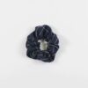 Overhead product display of environmentally friendly fair trade organic cotton Anchal brand scrunchie navy color.