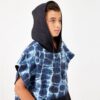 Boy with hood of eco-friendly, recycled Kids Changing Poncho in Agua Blue for swim, pool, beach, camping and more