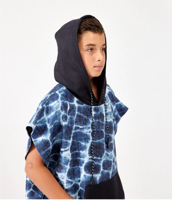 Boy with hood of eco-friendly, recycled Kids Changing Poncho in Agua Blue for swim, pool, beach, camping and more