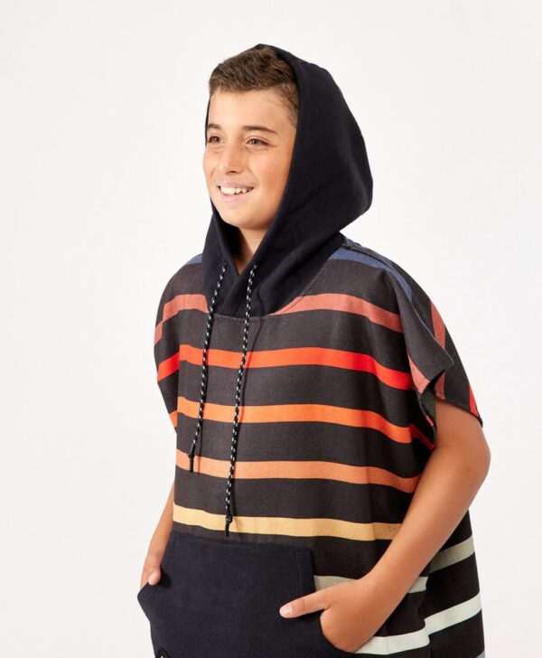 Young boy with hood of quick dry changing poncho in Pinstripes Multi for sustainable travel