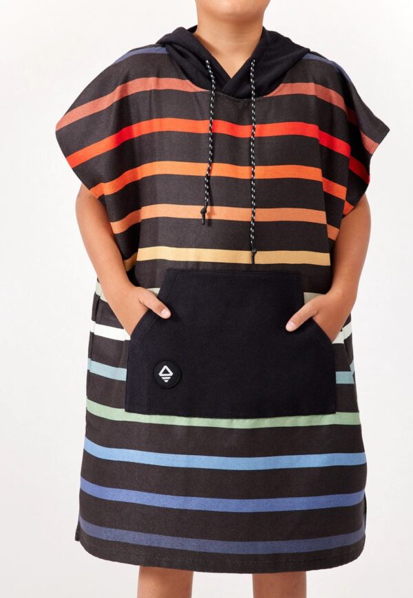Hands in pockets of eco-friendly, recycled kids Pinstripes Multi Changing Poncho for swim, beach, camping and travel