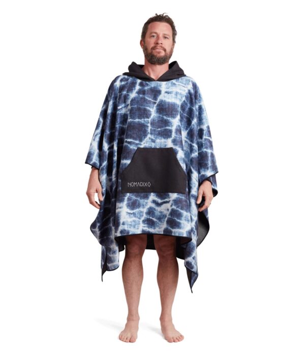 Man wearing one size Agua Blue Poncho Towel and Blanket for travel