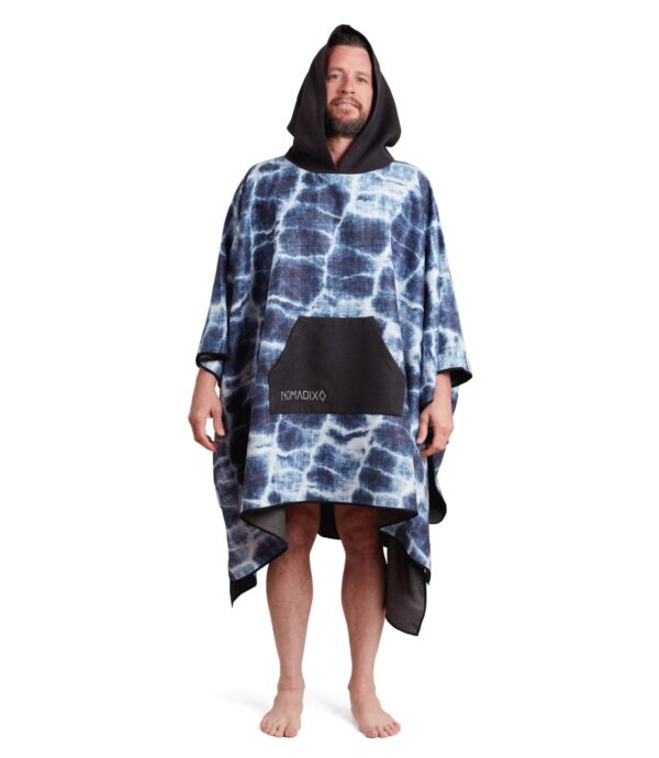 Man with hood up in recycled Agua Blue Poncho Towel for sustainable travel