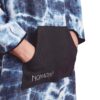 Hands in pocket of swim, scuba and beach Poncho Towel in Agua Blue