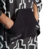 Hands in pocket of recycled Teton Black Poncho Towel for scuba, swim, travel, van life and more.