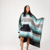Woman in Baja Aqua Poncho Towel for surf, swim, pool, beach, lake and more.