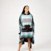 Woman with hands in front pocket of one-size, quick dry Baja Aqua Poncho Towel