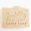 Up-close photo of the all-natural camp soap by Fire Lake Soapery with camping scene imprinted into the soap.
