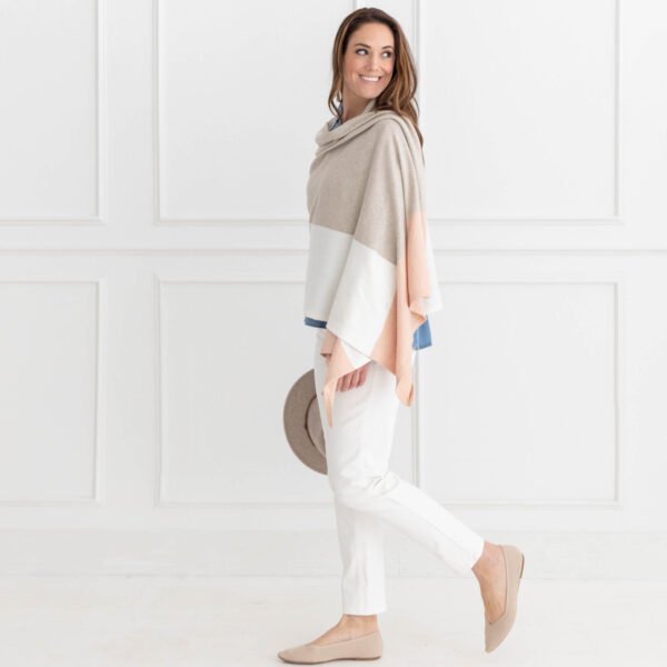 Woman in eco-friendly one-size travel scarf in blush pink colorblock