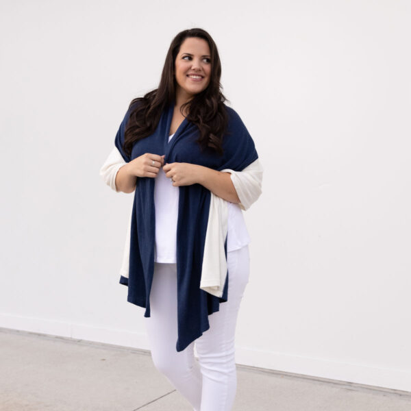 Woman in fair-trade, organic cotton travel scarf in navy and cream