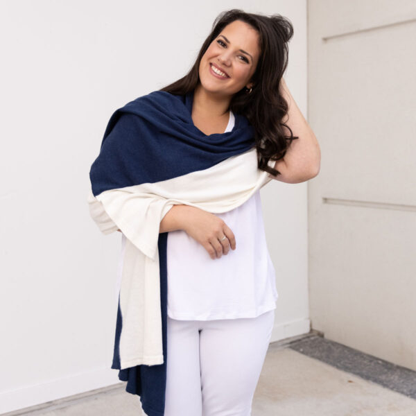 Women in navy and cream dreamsoft travel scarf made with organic cotton