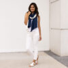 Woman wearing fair trade, organic cotton travel scarf in navy and cream
