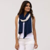 Women wearing navy and cream sustainable travel scarf
