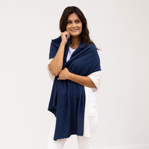 Women wrapped in eco-friendly, organic cotton travel scarf from women-owned Zestt Organics