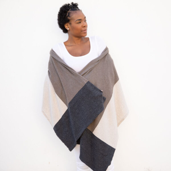 Woman in brownstone colorblock dreamsoft travel scarf from women-owned Zestt Organics