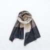 Overhead view of fair trade, organic cotton travel scarf in beige and grey colorblock