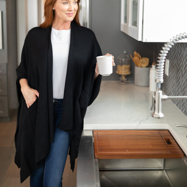Woman in kitchen in eco-friendly organic cotton black wrap