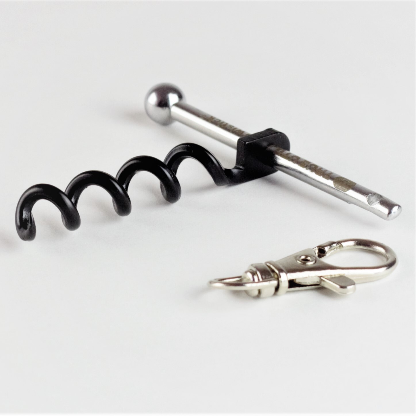 TRUE-TWISTICK-13 The stainless steel bar passes through the center of the full-size corkscrew helix to create a fully-functional corkscrew for your next picnic or adventure.