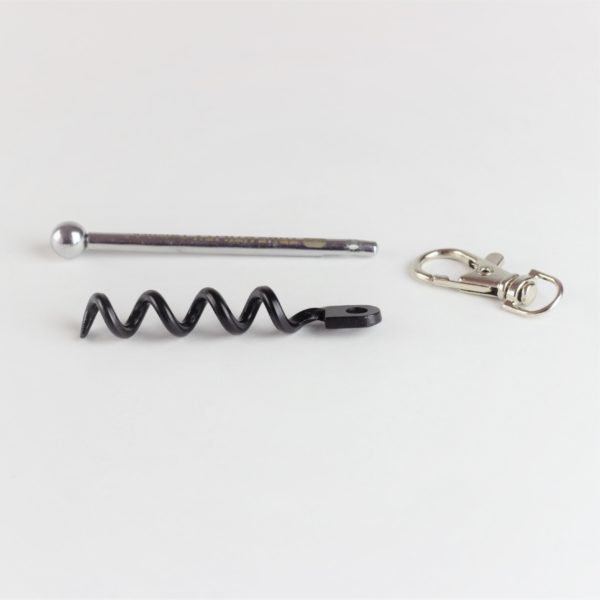 The Twistick travel corkscrew comes with a full-size corkscrew helix, a stainless steel bar, and a keychain attachment. Each part is less than 3 inches long.