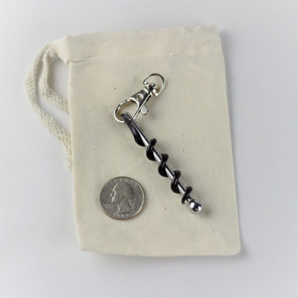 The travel friendly corkscrew by True is shown next to a quarter for comparison; it is only 2.6 inches in length.