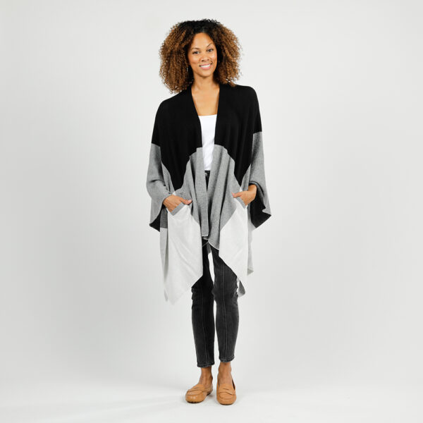 Woman in eco-friendly travel clothing, the black and grey colorblock wrap of organic cotton
