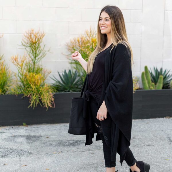 Woman with purse in fair-trade, organic cotton one-size cape wrap