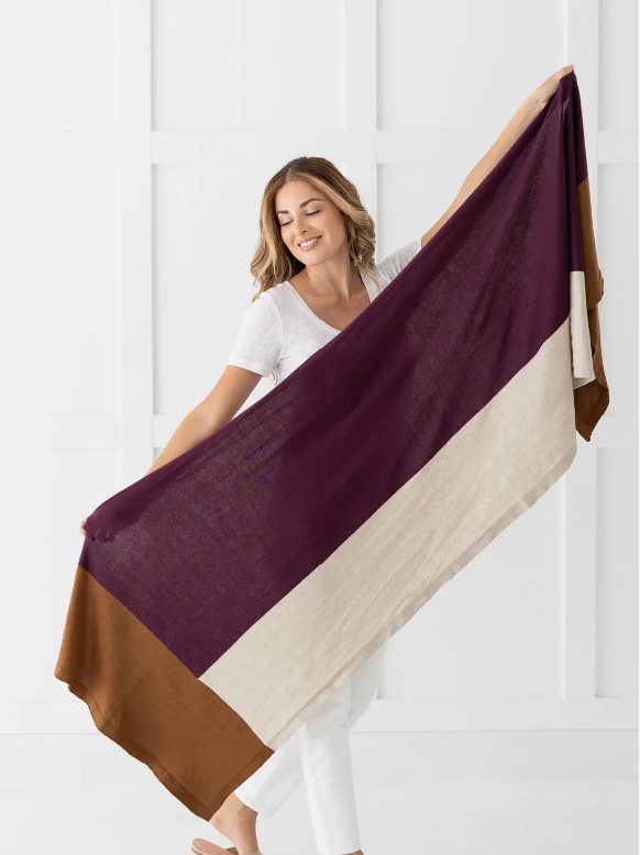 Female showing full length of mulberry organic cotton travel block scarf