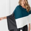 Female in teal colorblock organic cotton travel scarf