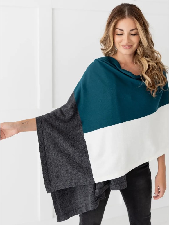 Female in teal colorblock organic cotton travel scarf
