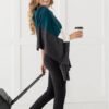 Female traveler in teal colorblock organic cotton scarf