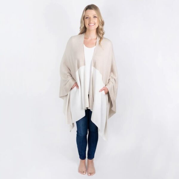 Front view of woman in tan and ivory sustainable organic cotton one-size travel wrap
