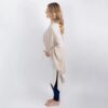 Side view of woman in ivory and tan colorblock organic cotton travel wrap