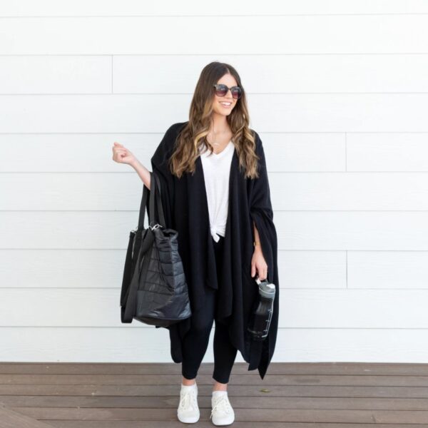 A model is out running errands while wearing the travel wrap made by Zestt Organics. This wrap is like wearing a blanket while on-the-go.