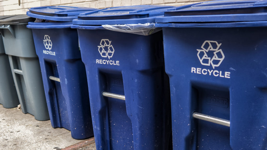 Blue recycling bins for tips to recycle right